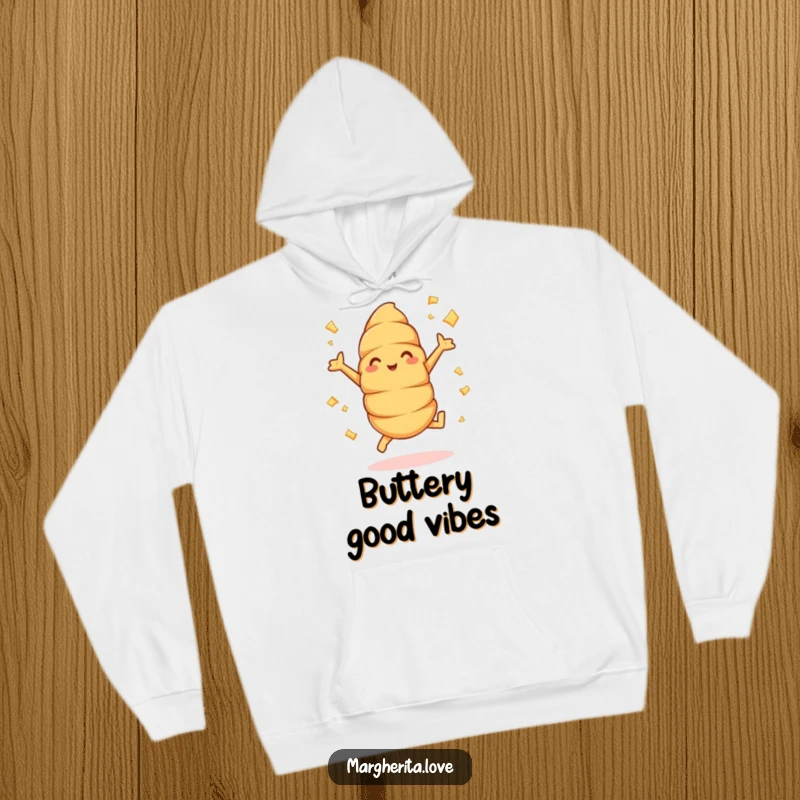 Funny croissant hoodie with a design of a cheerful pastry doing jumping jacks, with buttery flakes flying, offering warmth and humor.